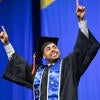 Graduate celebrating on stage